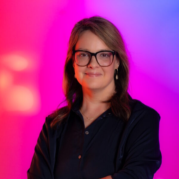 Rachel Spencer standing, smiling at camera