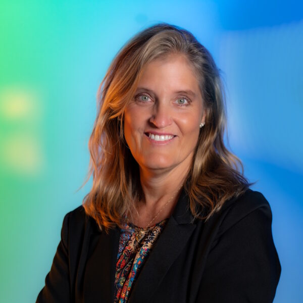 Melissa Mays standing, smiling at camera