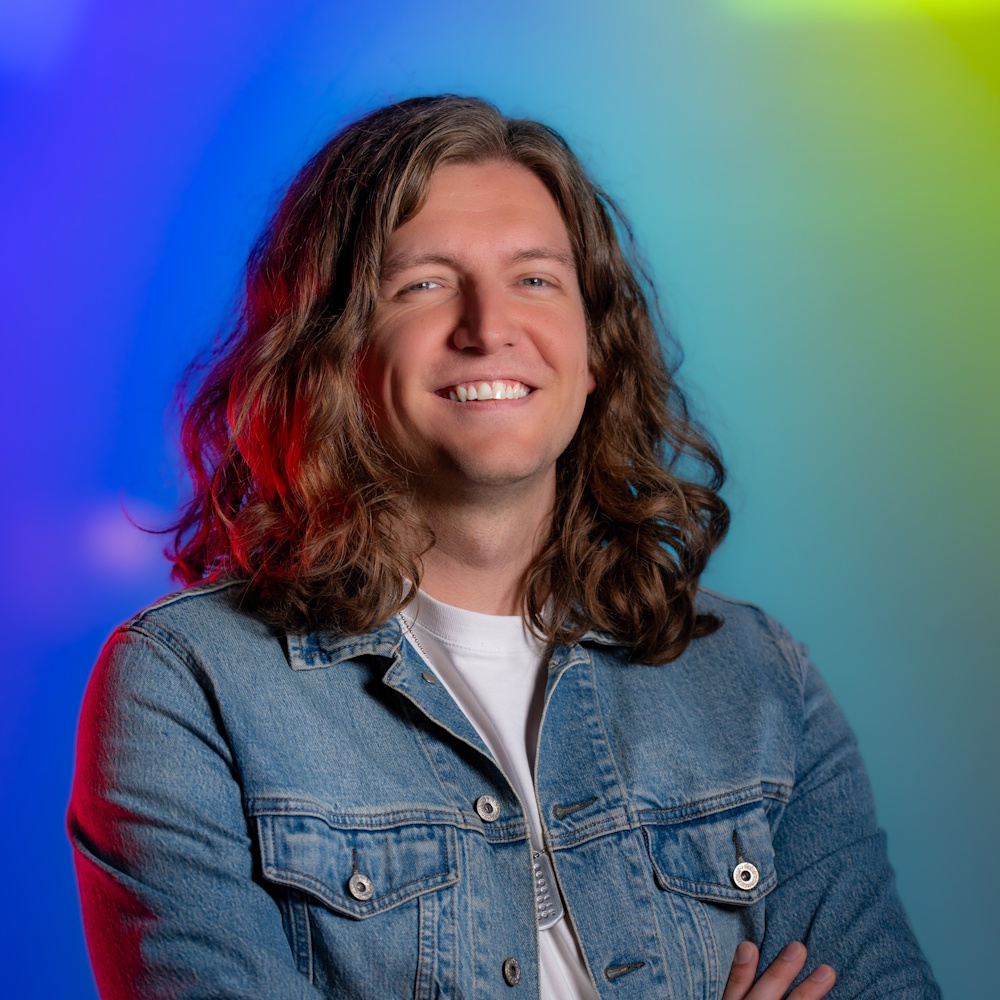 Lucas Weaver standing, smiling at camera