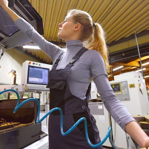 woman working on machine