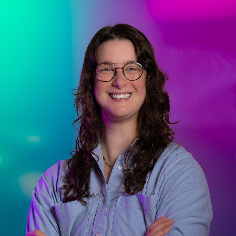 Emma Hughes standing, smiling at camera