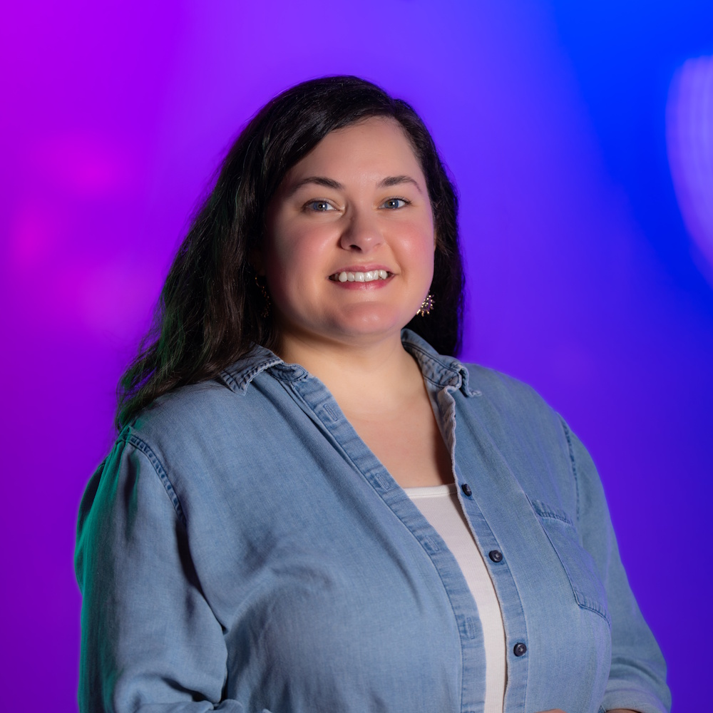 Stephanie Roberts standing, smiling at camera