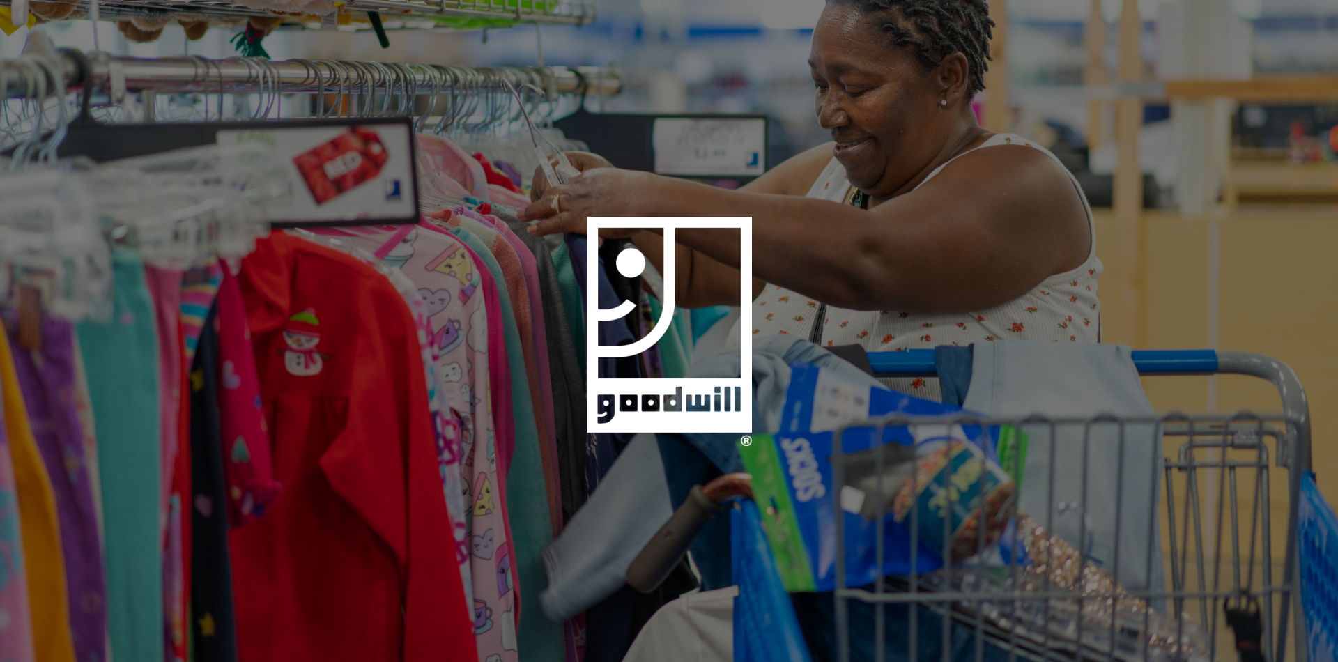 A woman browsing through clothing selections.