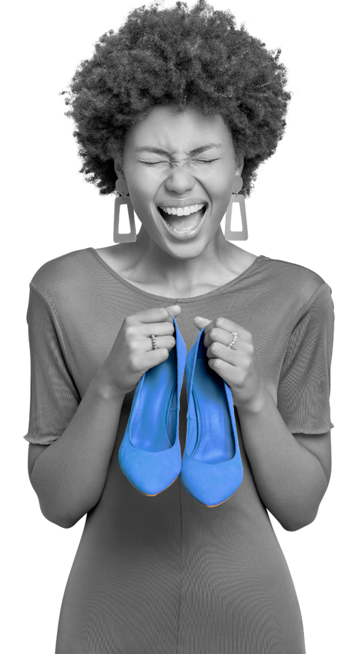 Grayscale photo of an African American woman holding a pair of blue shoes