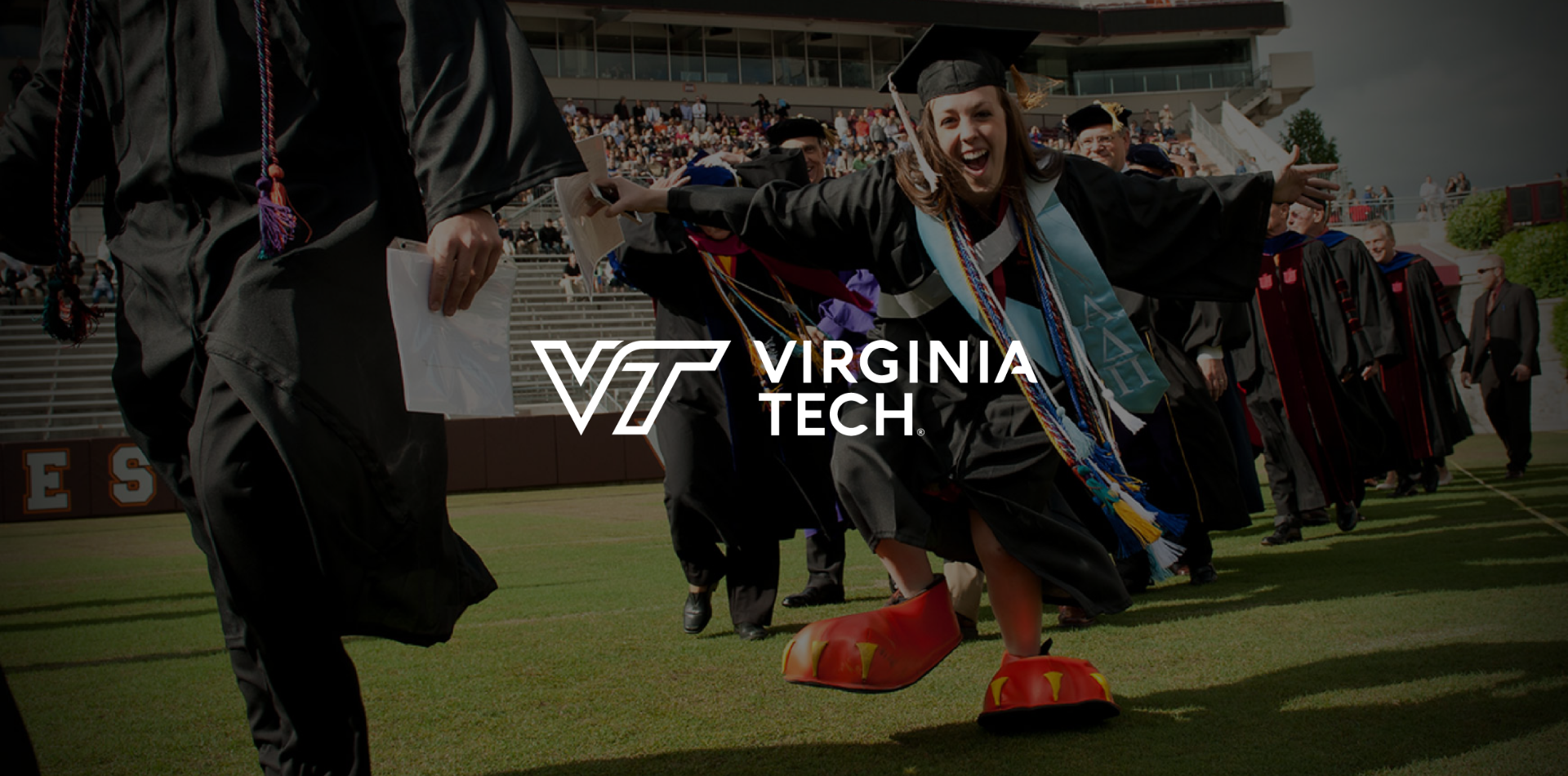 Virginia Tech graduates celebrating on the field