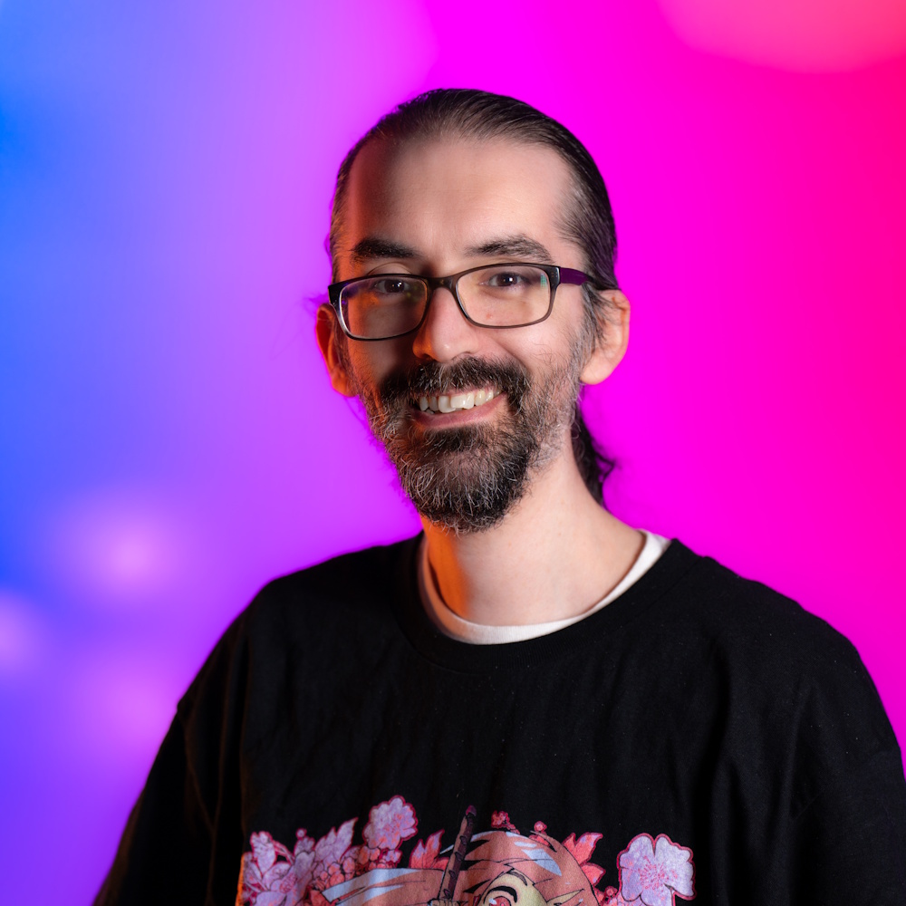 Josh Wagner standing, smiling at camera