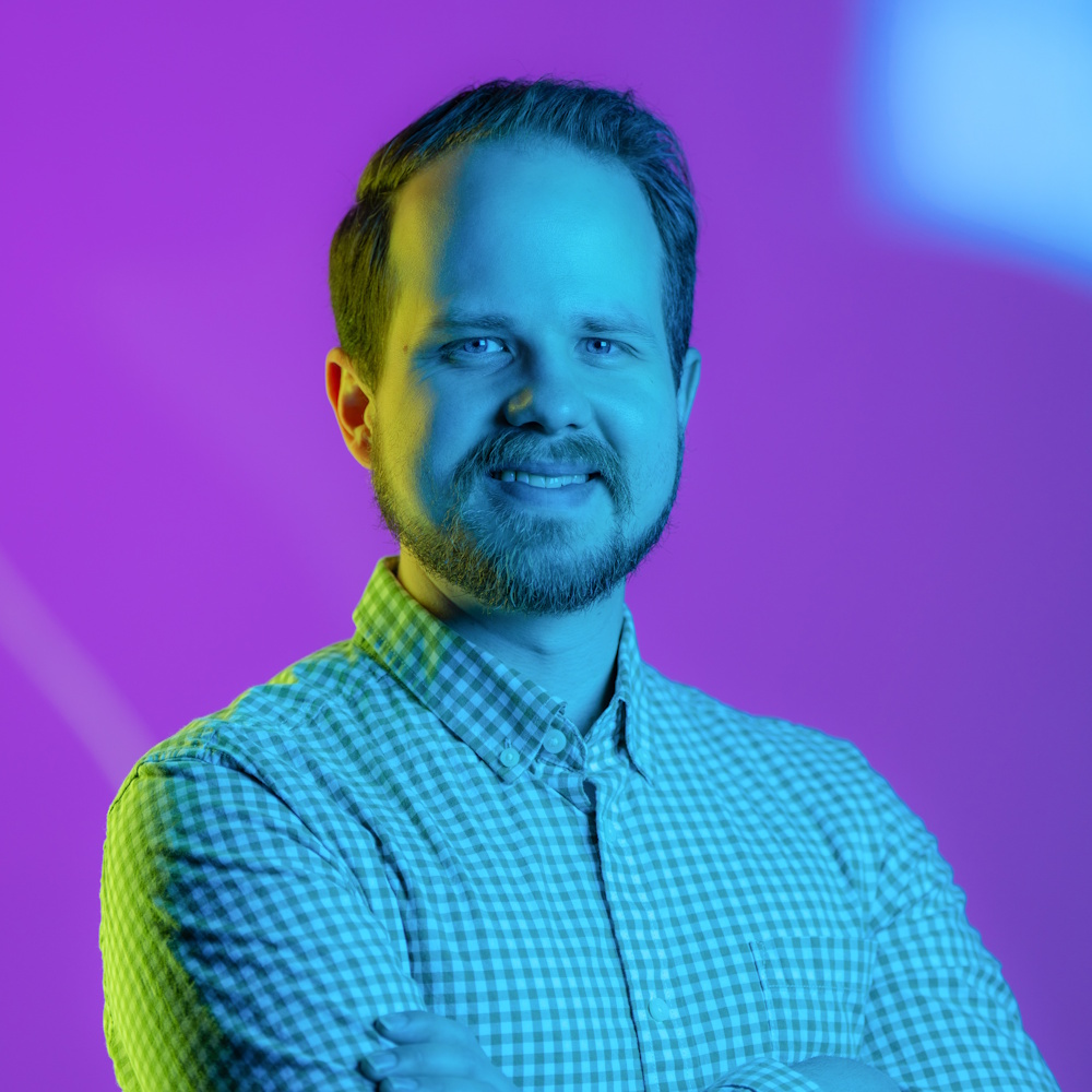 Riley Murtagh looking at camera, arms crossed