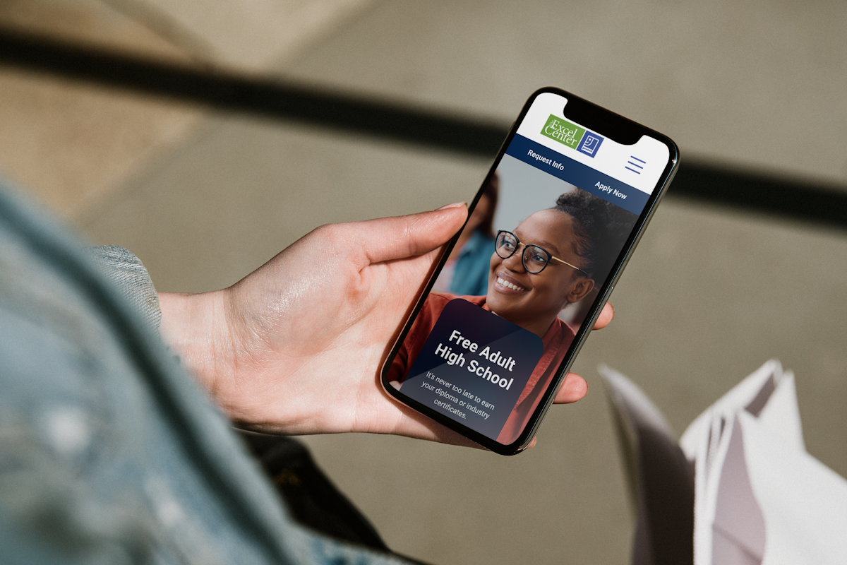 A smartphone showing the Excel Center website