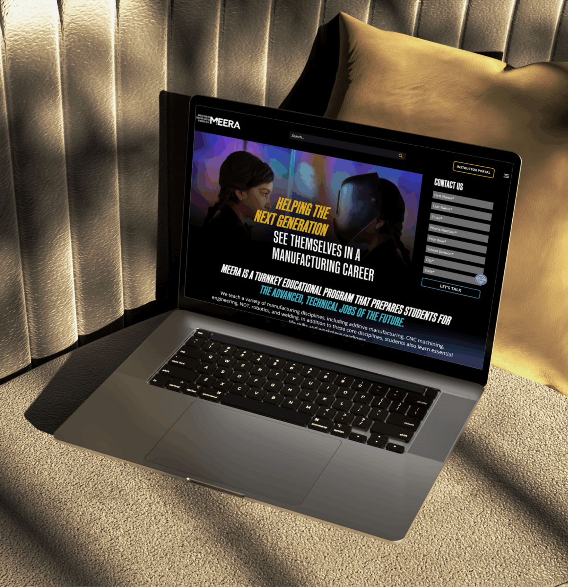 A laptop showing the MEERA Education website.